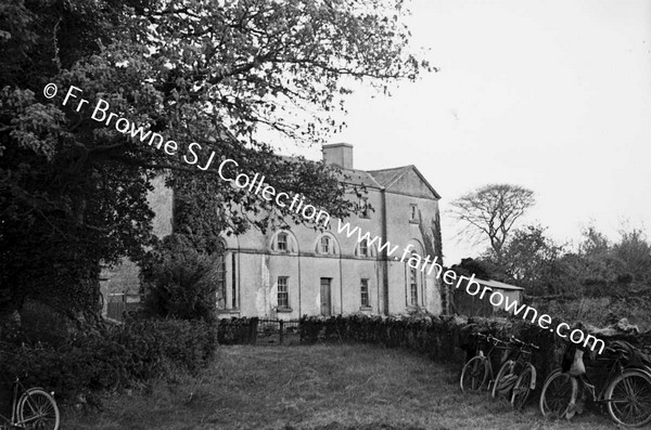 HOUSE WITH BICYCLES IN FOREGROUND